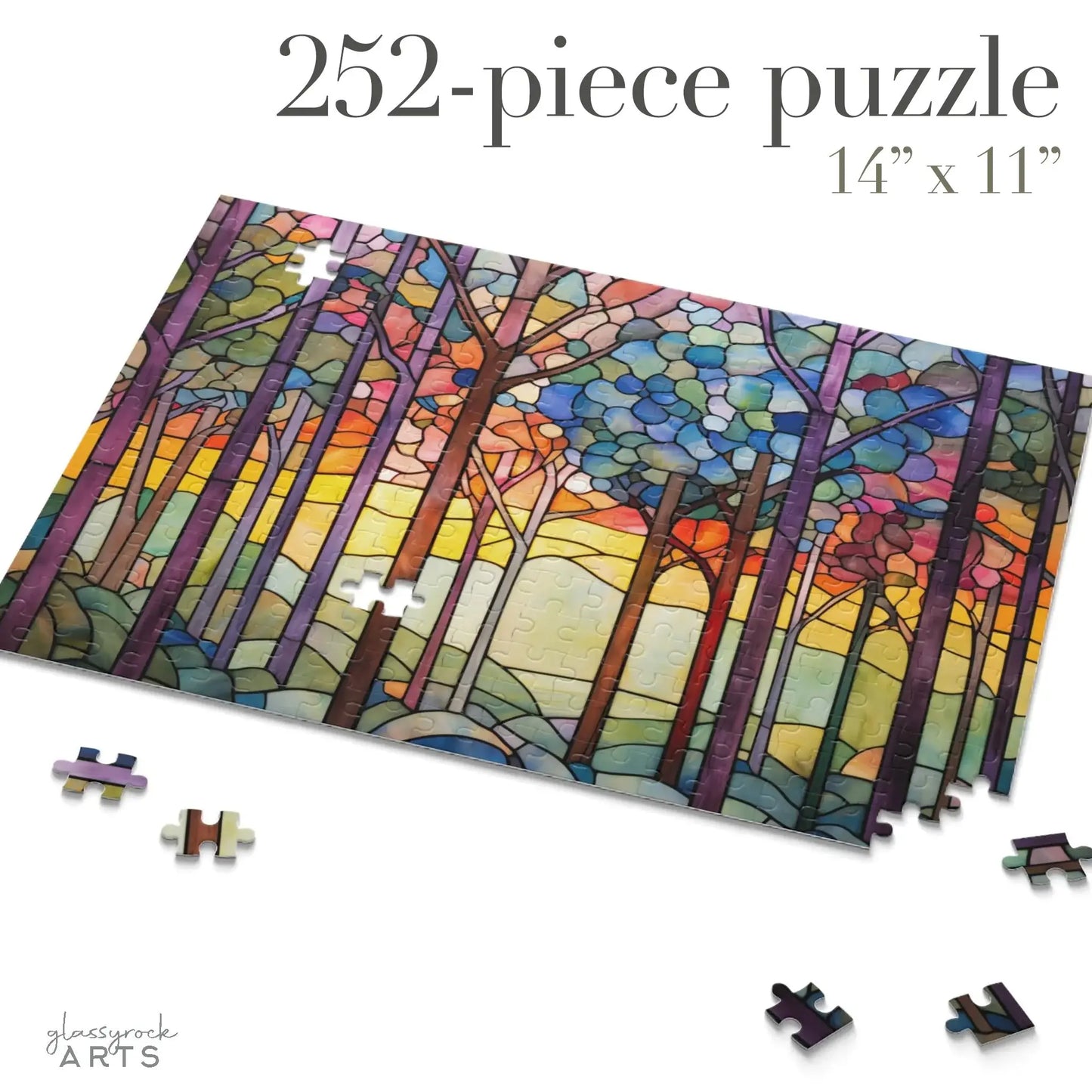 The 252-piece Rainbow Forest Jigsaw Puzzle showcases a stained glass-inspired design with rainbow-colored, slender trees against a vibrant sunset. Scattered pieces on a white surface make it an ideal nature-themed gift for enthusiasts.