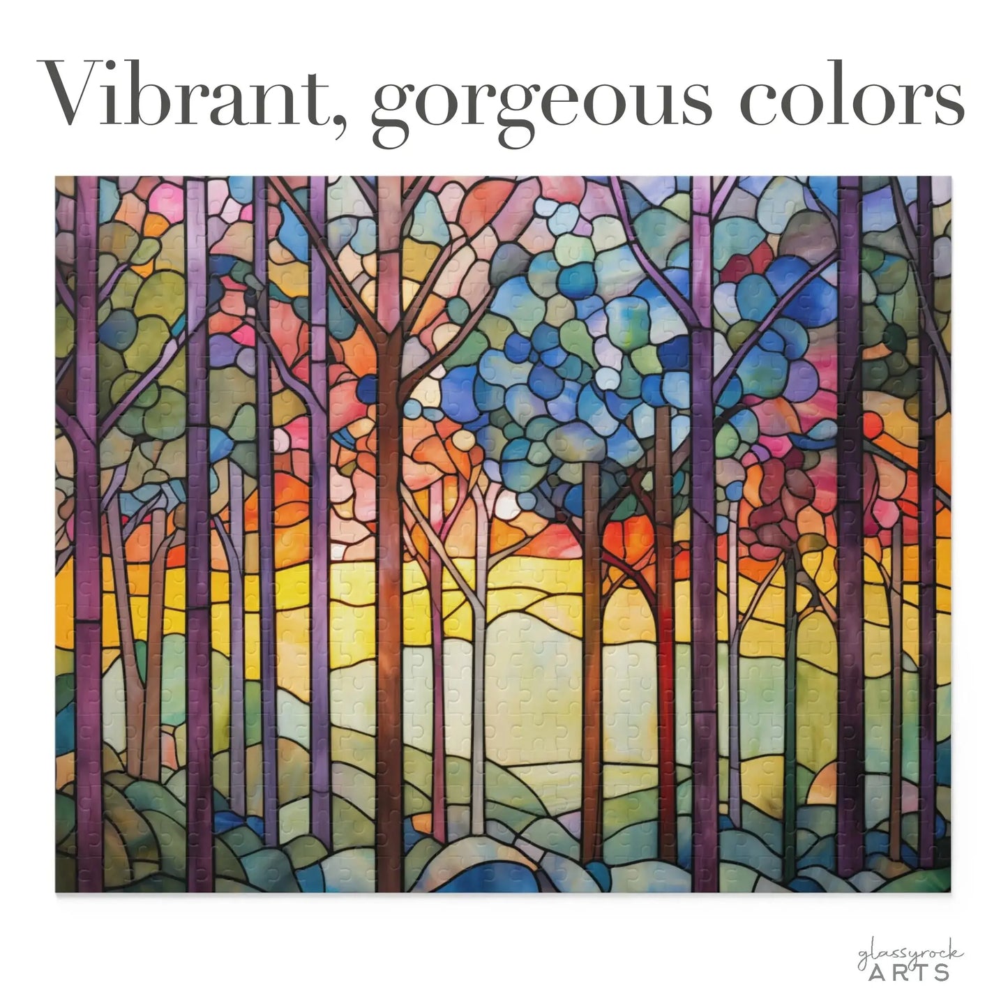 The Rainbow Forest Jigsaw Puzzle features a stained glass-inspired artwork of a rainbow-colored forest with tall trees. It showcases vibrant blues, purples, oranges, and yellows resembling sunrise or sunset. The text Vibrant, gorgeous colors is next to the logo—an ideal nature gift.