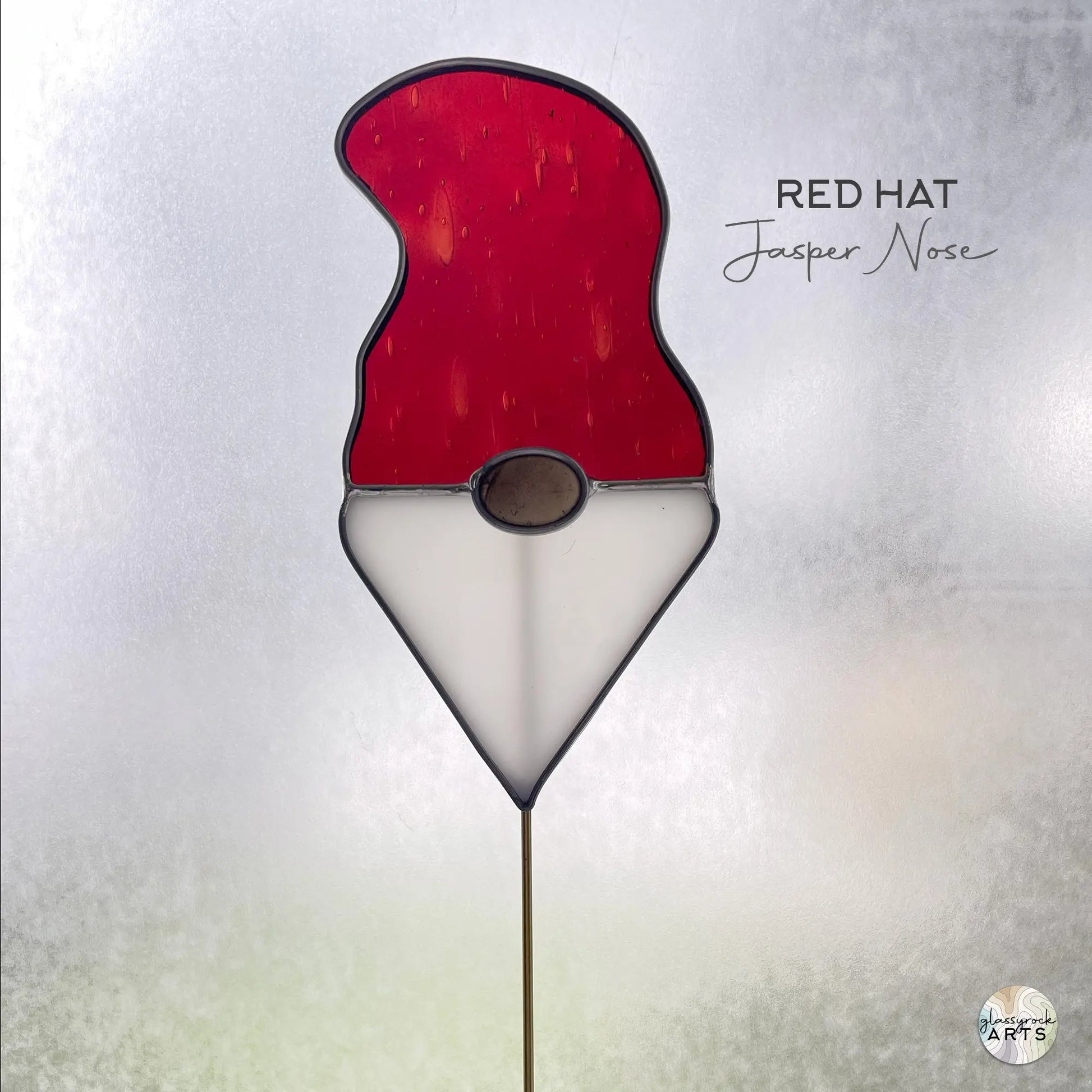 A picture of the Handmade Stained Glass Gnome Plant Stake - Red Hat from GlassyRock Arts.