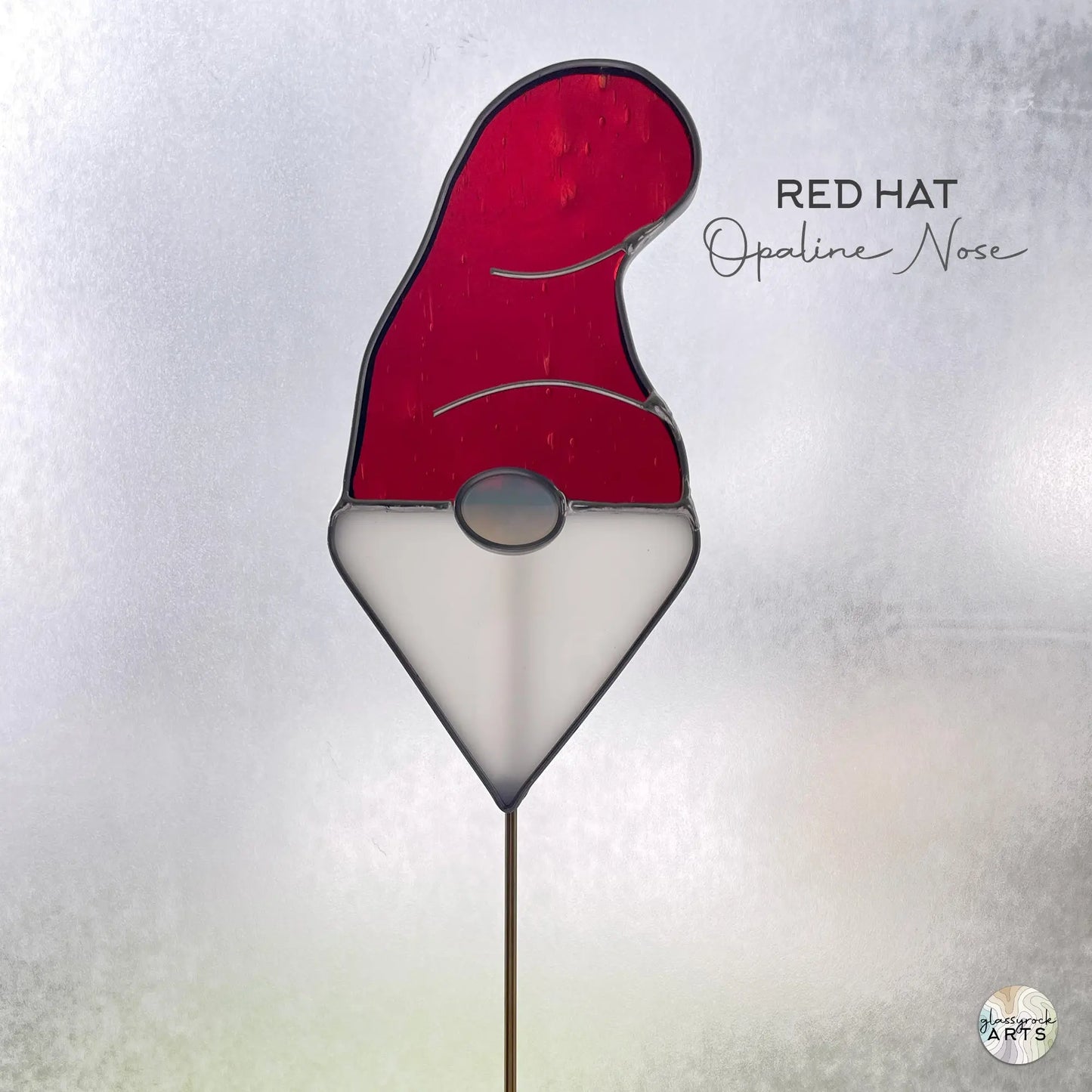 A picture of the Handmade Stained Glass Gnome Plant Stake - Red Hat from GlassyRock Arts.