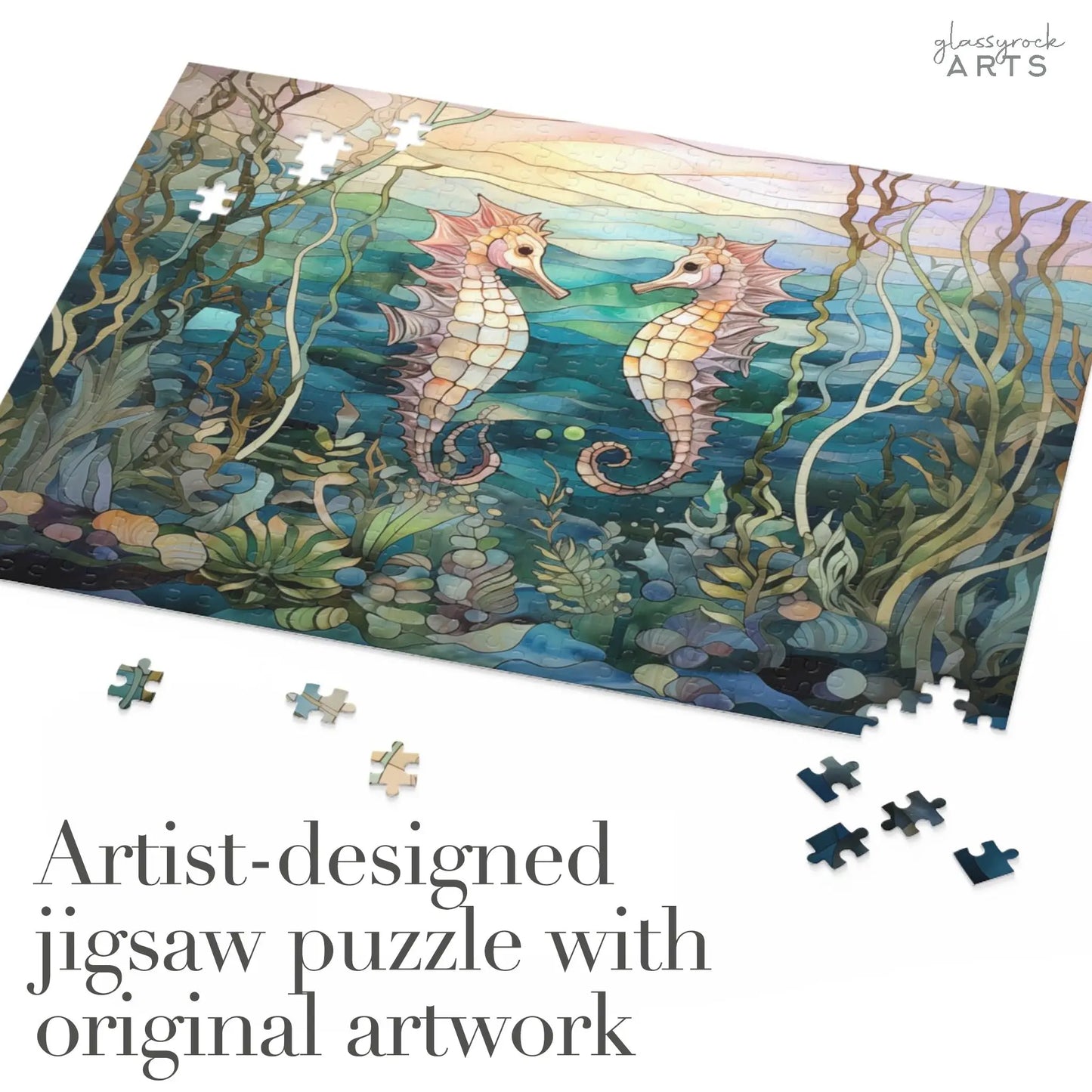 The Stained Glass Seahorses Jigsaw Puzzle showcases an underwater scene with seaweed, echoing a masterpiece in stained glass. The blue and green background complements the text: Artist-designed jigsaw puzzle with original artwork, amidst scattered pieces.