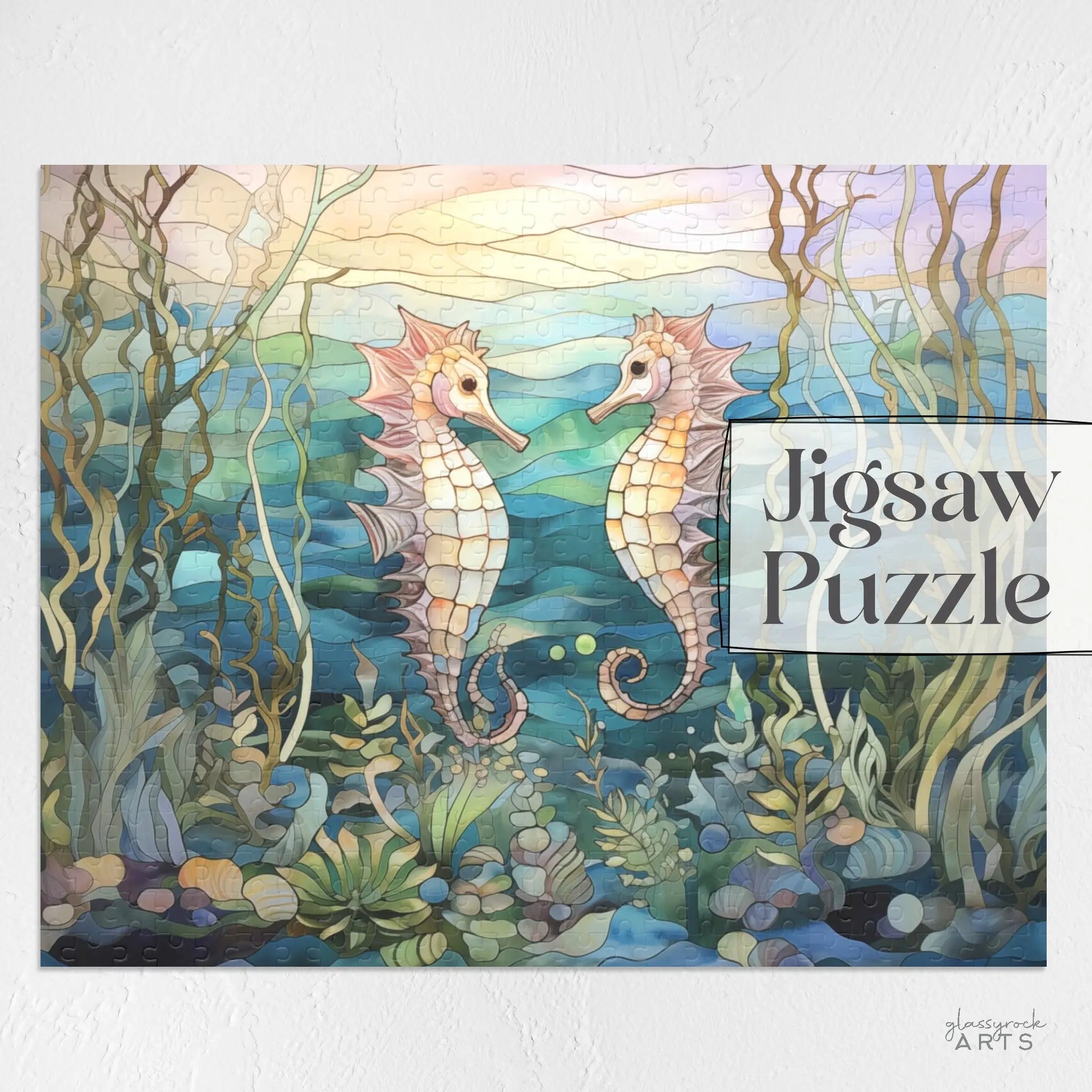 The Stained Glass Seahorses Jigsaw Puzzle features two seahorses facing each other between seaweed, with a background of soft blues and greens and gentle, filtering light, making it an ideal gift for nature lovers.