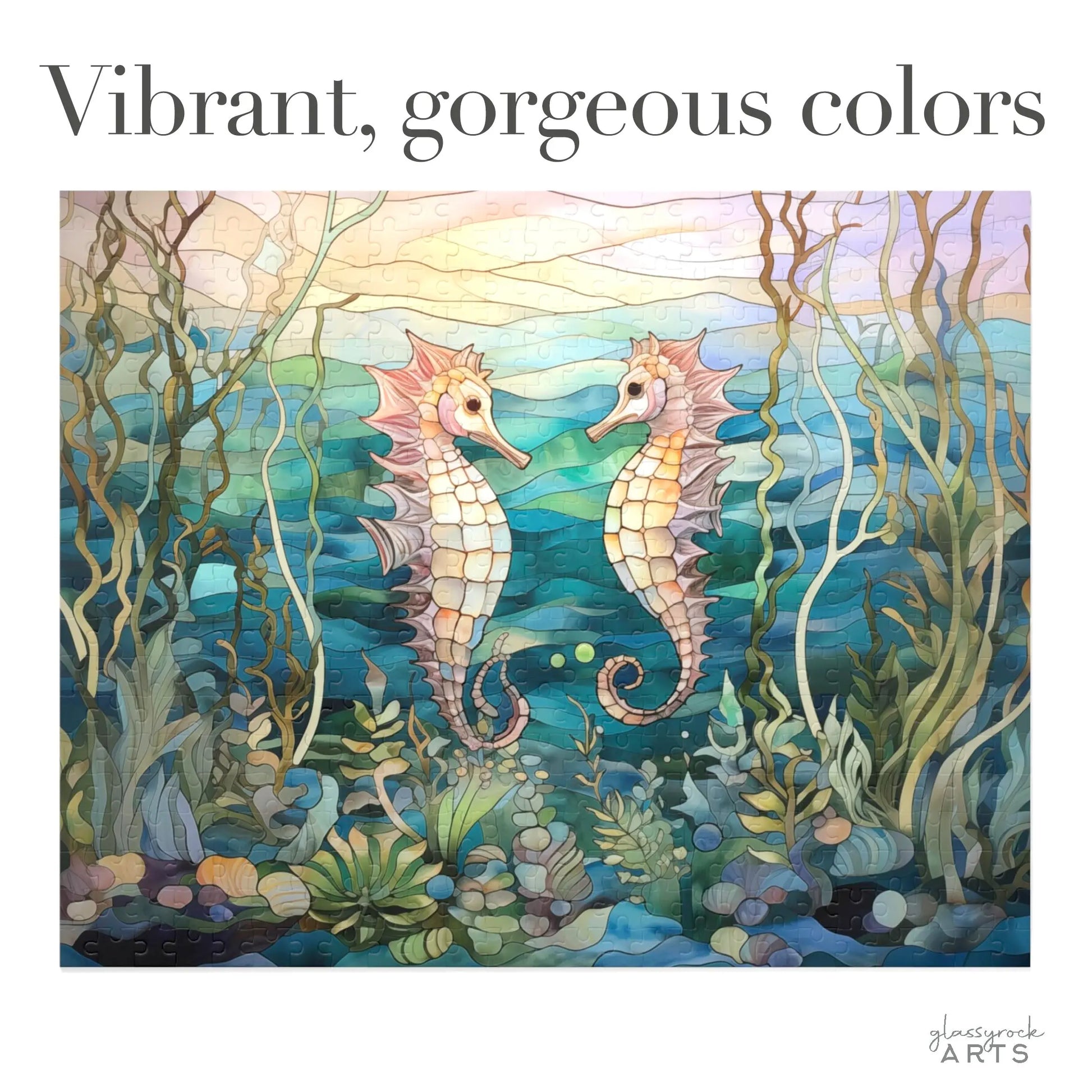 The Stained Glass Seahorses Jigsaw Puzzle features two seahorses facing each other amidst vibrant seaweed and coral, creating a stained glass effect. Text reads Vibrant, gorgeous colors, with the glasswork ARTS logo in the corner. Ideal gift for nature lovers.