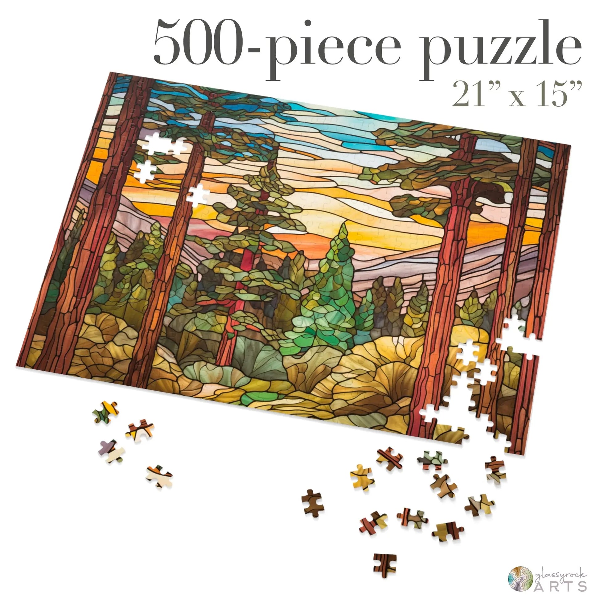 The Stained Glass Sequoia Forest Jigsaw Puzzle features a 500-piece design of tall trees against a colorful sunset. The partially completed scene spans 21x15 inches and arrives in a gift-ready metal box, perfect for displaying on your table.