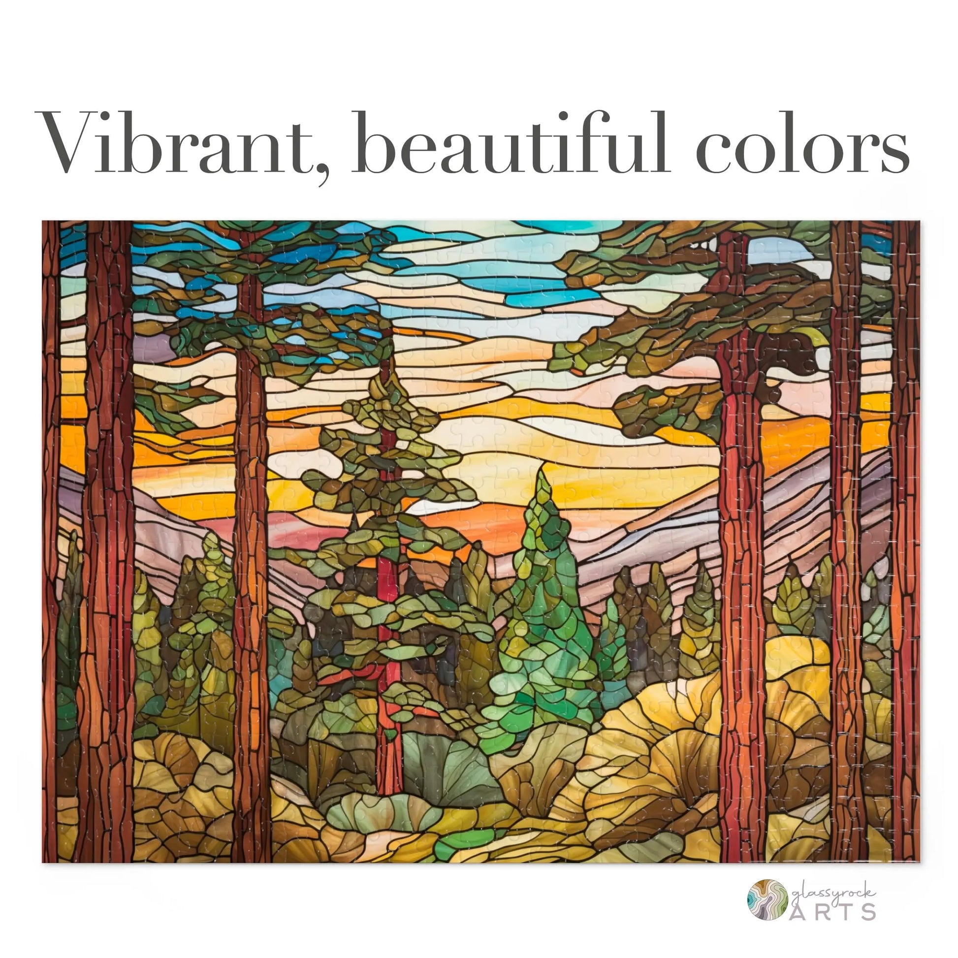The Stained Glass Sequoia Forest Jigsaw Puzzle recreates a colorful scene of tall trees and a sunset sky in vibrant shades of orange and yellow, highlighted with the text Vibrant, beautiful colors. Its an ideal gift for puzzle enthusiasts.