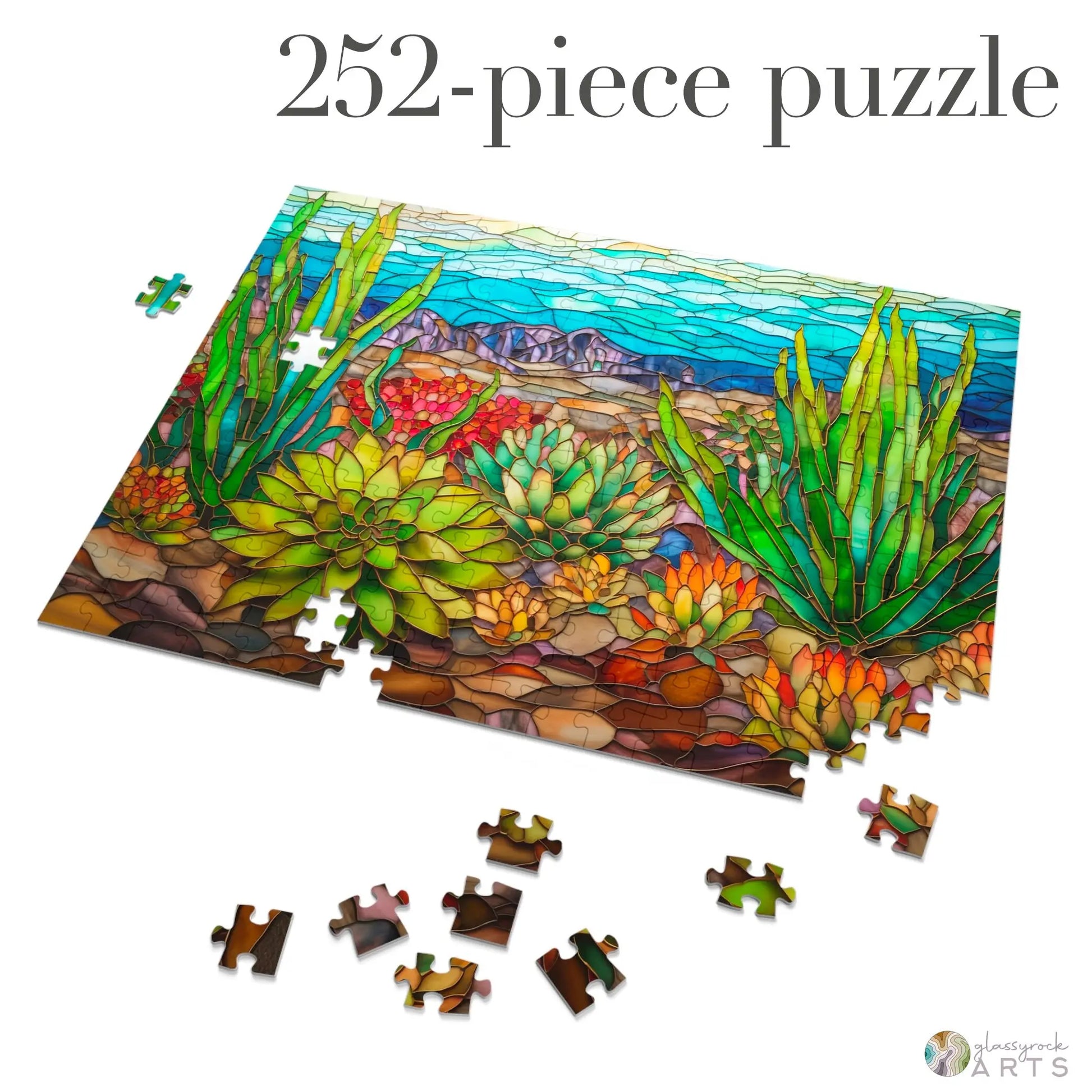 A partially completed Stained Glass Succulents Jigsaw Puzzle showcases intricate desert scenery with vibrant greens, reds, and blues. The 252-piece gift-ready puzzle text at the top makes it an ideal choice for any puzzle enthusiast.
