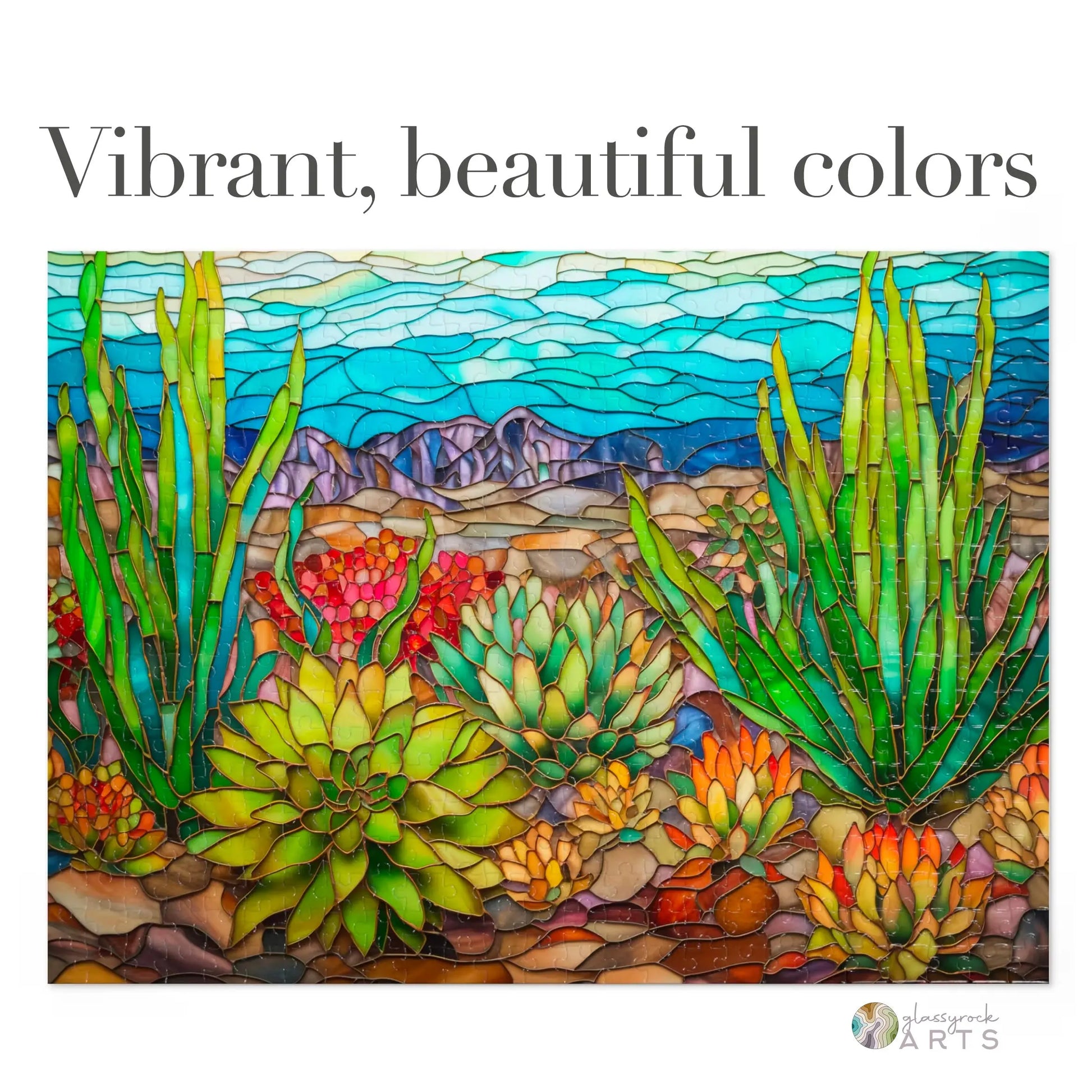 A vibrant Stained Glass Succulents Jigsaw Puzzle showcasing a desert landscape with tall grasses, succulents, and rolling hills under a blue sky. Dominated by bright greens, blues, and earth tones, it exudes jigsaw puzzle vibes with the text Vibrant, beautiful colors.