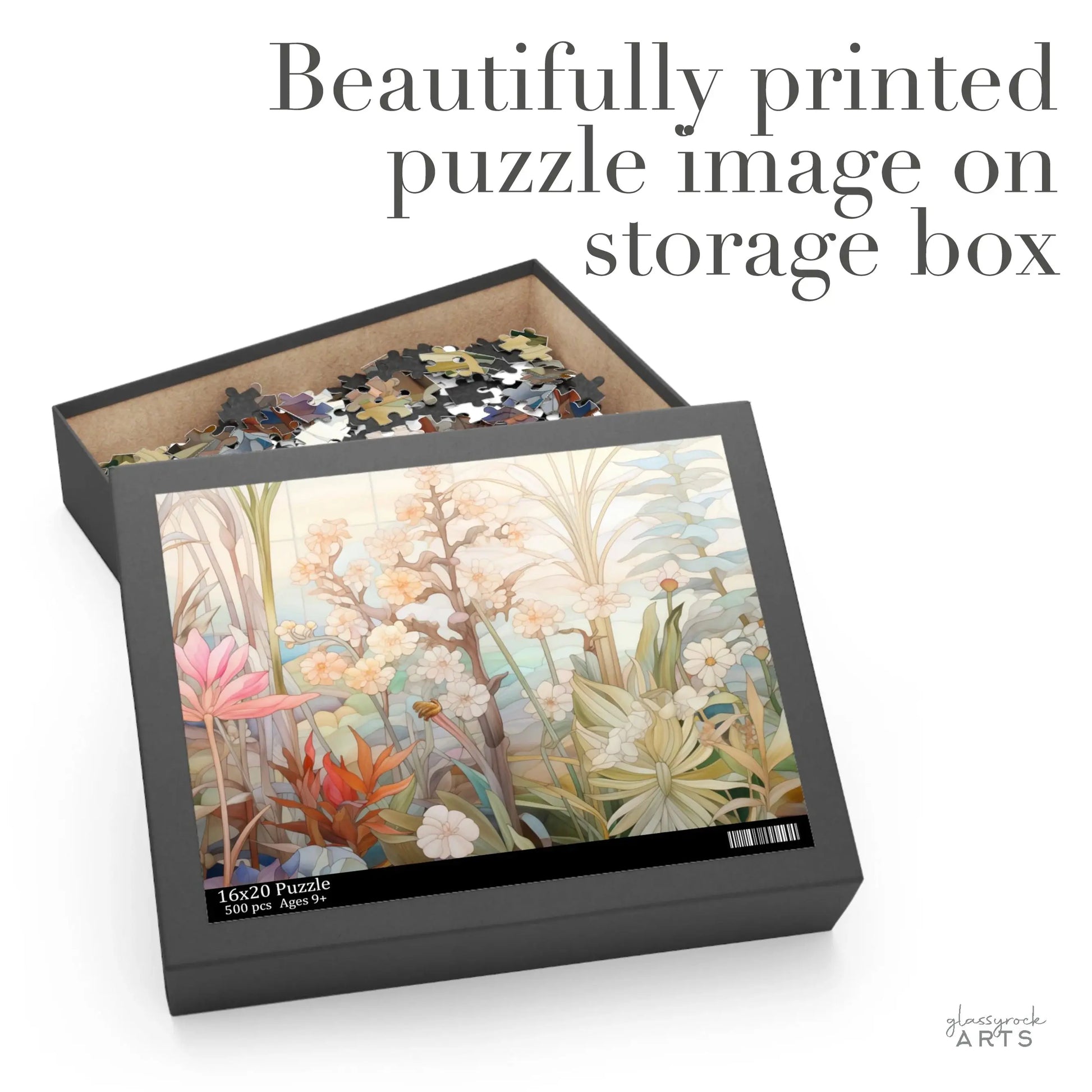 The Summer Botanicals Jigsaw Puzzle box displays a partially completed puzzle with intricate floral designs of pink, orange, and white flowers. The text reads Beautifully printed puzzle image on storage box, making it an ideal art gift for any puzzle lover.