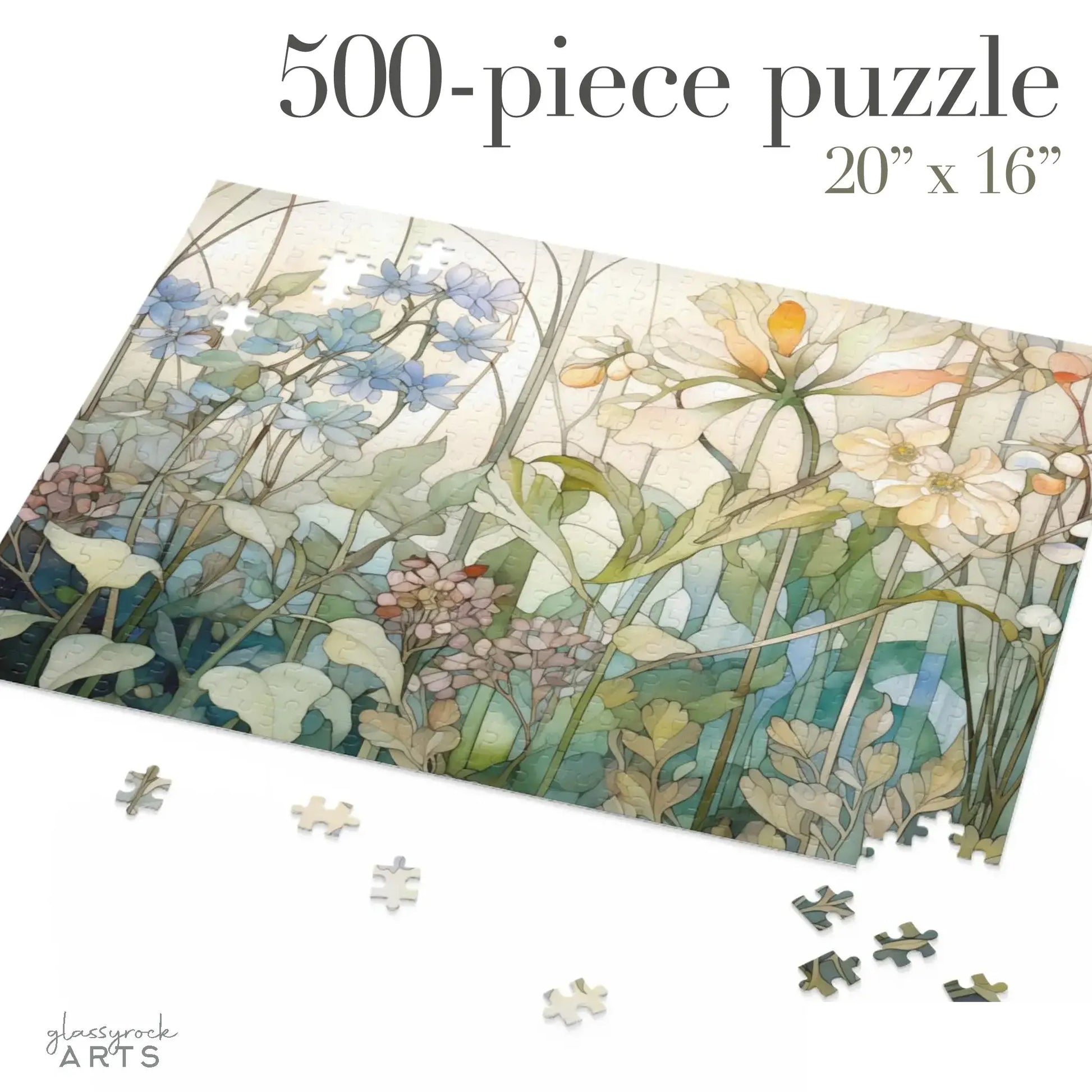 A partially completed 500-piece Summer Wildflowers Jigsaw Puzzle features an illustration of flowers and foliage in soft pastels, evoking summer blooms. Some pieces are scattered around, with text in the top corner reading 500-piece puzzle, 20” x 16”.