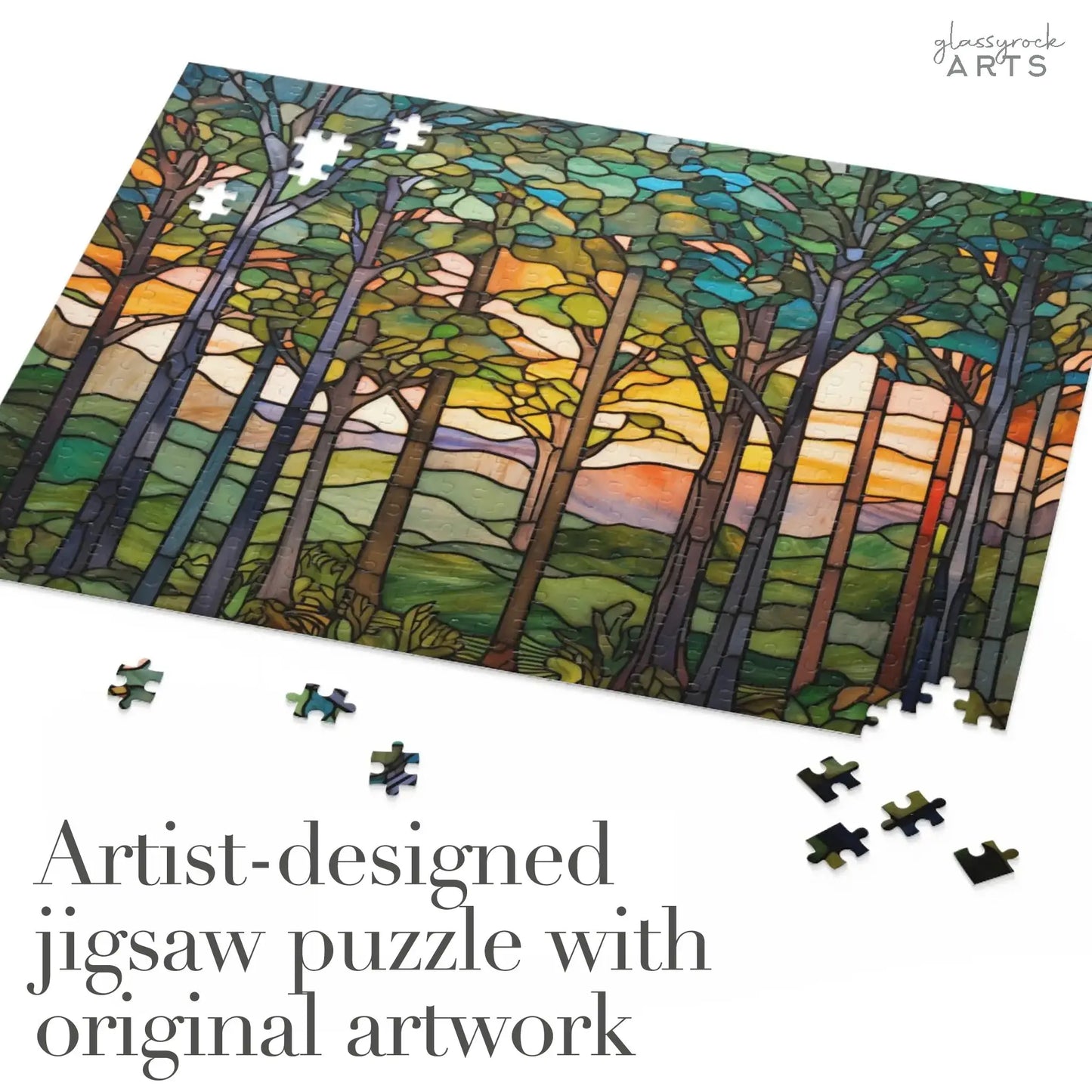 The Sunset Forest Jigsaw Puzzle displays vibrant artwork of a colorful sky, with scattered pieces inviting engagement. The text states, Artist-designed jigsaw puzzle with original artwork, making it an ideal stained glass gift for nature lovers.