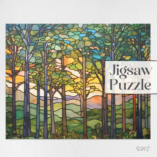 A stained glass-style artwork showing a sunset forest scene with tall trees, vibrant leaves, and a colorful sky. Its perfect for nature lovers and features the text Sunset Forest Jigsaw Puzzle on the right side.