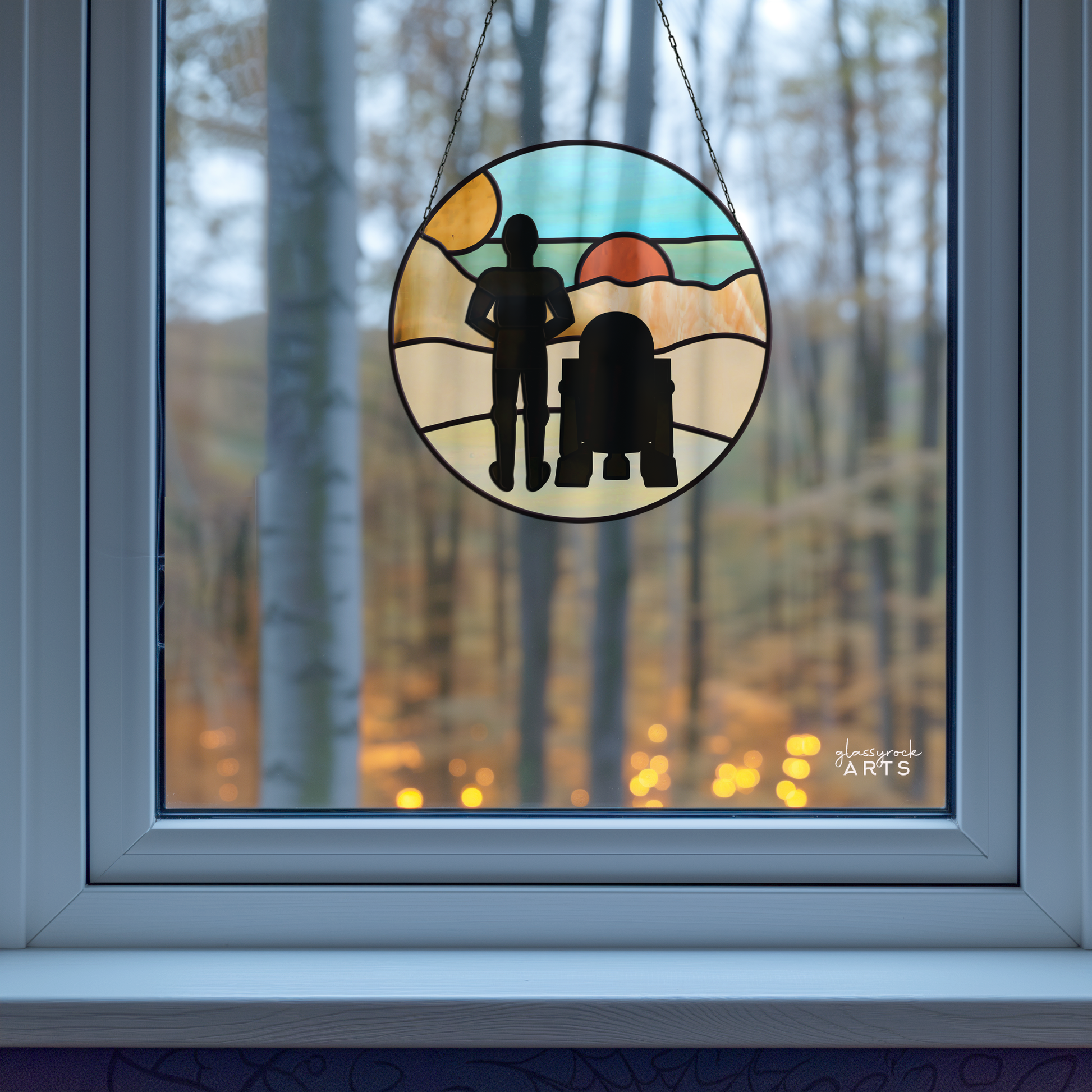 A stained glass masterpiece of the Tatooine Landscape Stained Glass Pattern showcases two figures against a sunset, blending with natures bare trees under soft, warm light to create an otherworldly digital design.
