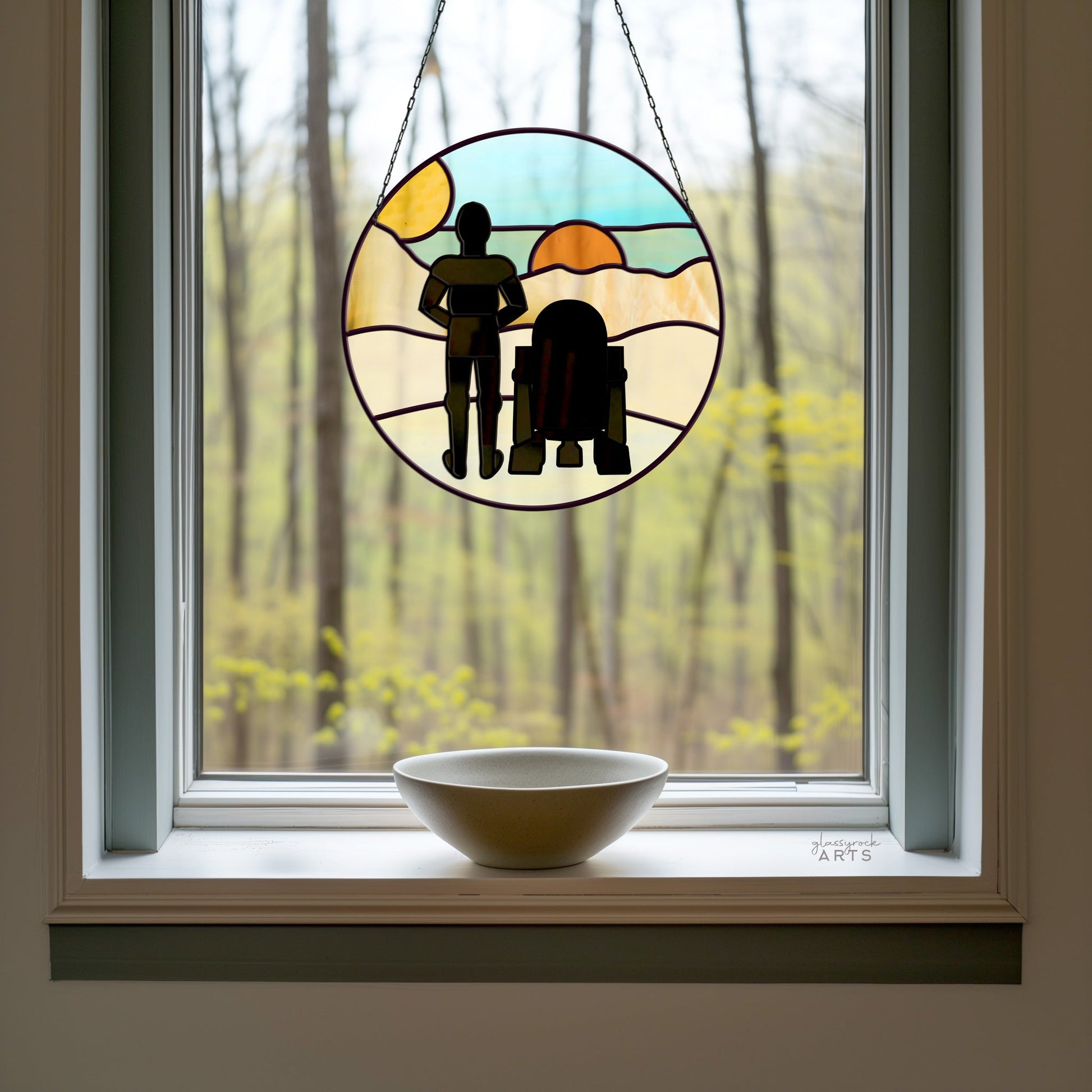 The Tatooine Landscape Stained Glass Pattern shows two silhouette figures, one tall and one short, against a green landscape through a window. A white bowl on the sill completes the scene.