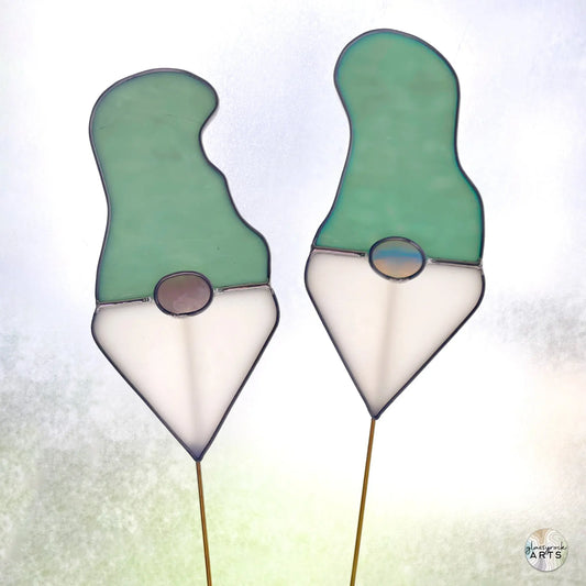 A picture of the Handmade Stained Glass Gnome Plant Stake - Teal Hat from GlassyRock Arts.