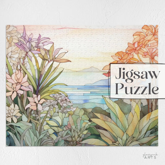 The Tropical Botanicals Jigsaw Puzzle features a watercolor-style tropical landscape with vibrant flowers and lush greenery. It has a stained glass-inspired design set against mountains and ocean, perfect for nature lovers. The cover displays Jigsaw Puzzle.