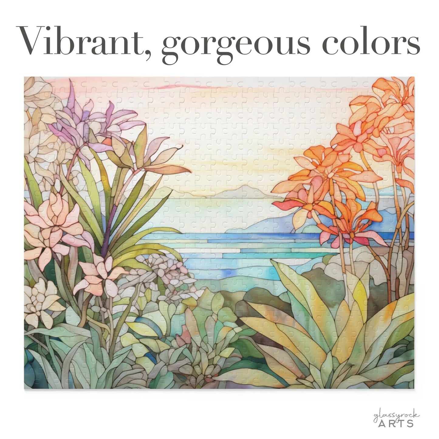 The Tropical Botanicals Jigsaw Puzzle features a stained glass-inspired design depicting a vibrant landscape with orange, pink, and purple flowers among green foliage, set against a serene blue body of water and soft mountains.