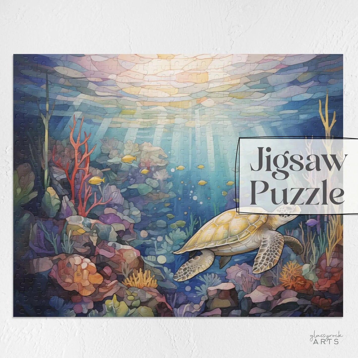 The Sea Turtle Reef Jigsaw Puzzle showcases a sea turtle swimming among vibrant corals and fish in an enchanting underwater scene, with sunlight beams creating a stained glass effect. The text Sea Turtle Reef Puzzle appears on the right side, making it an ideal art gift.