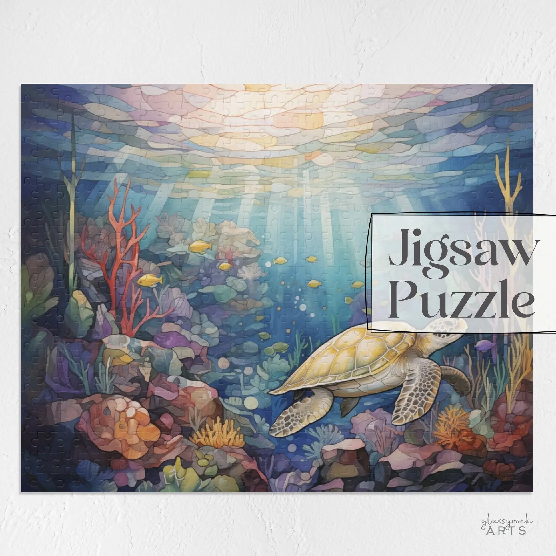 The Sea Turtle Reef Jigsaw Puzzle showcases a sea turtle swimming among vibrant corals and fish in an enchanting underwater scene, with sunlight beams creating a stained glass effect. The text Sea Turtle Reef Puzzle appears on the right side, making it an ideal art gift.