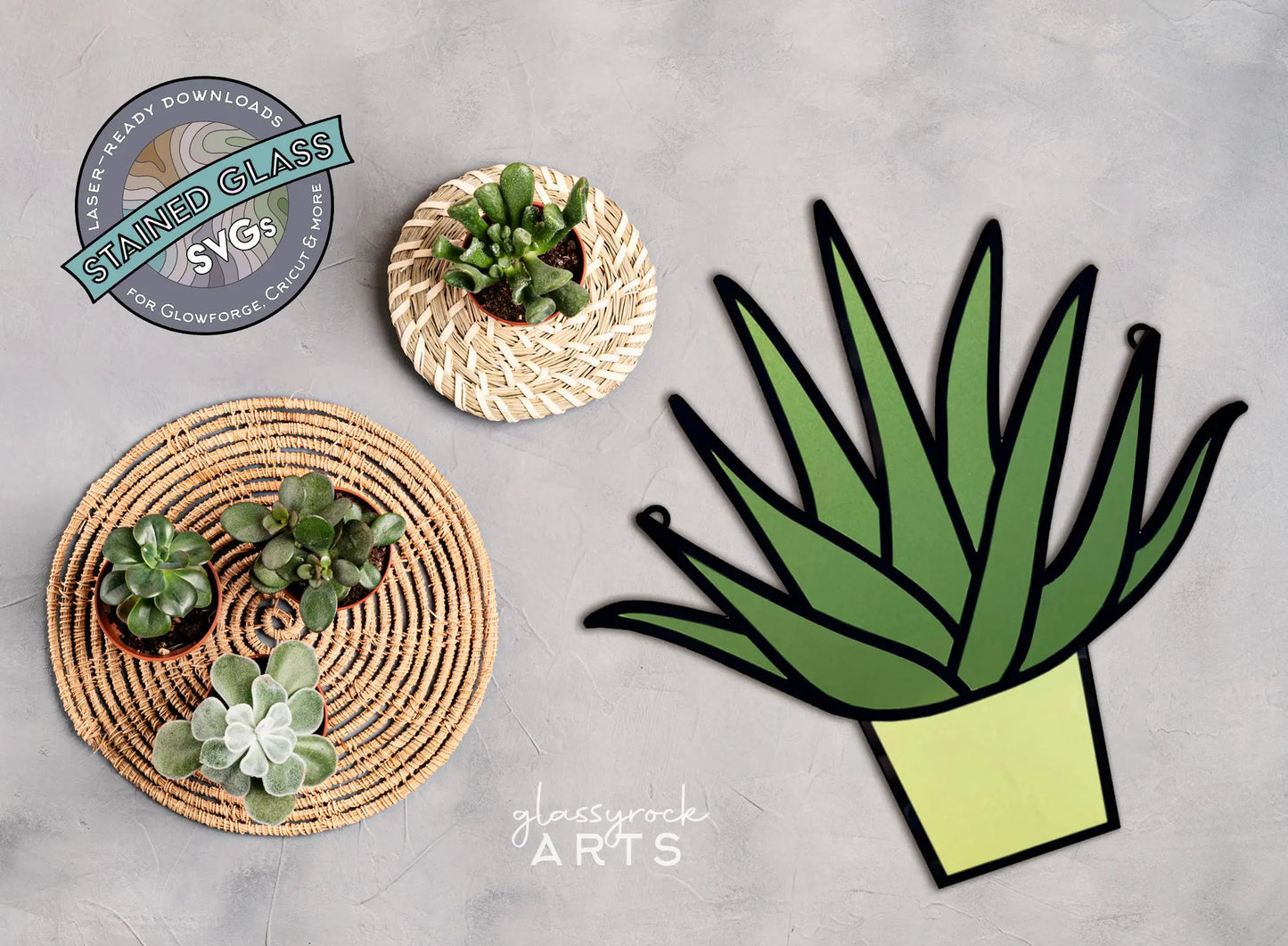 Two round woven baskets with succulents, including an aloe, are shown from above. A large stained glass artwork titled Stained Glass Aloe Plant, SVG for Laser Cutting depicting a green plant in a pot is on the right. The background is light gray with the glassyrock ARTS logo and text visible.
