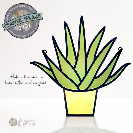 Illustration of a stained glass style aloe succulent plant with green leaves in a yellow pot. Text reads, Create this stained glass aloe plant using laser cutting and acrylic! Features logos for Stained Glass SVGs and Glassyrock ARTS. Ideal as an SVG download.
