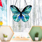 Beginner stained glass pattern for a butterfly, instant PDF download, shown hanging in a window with a snowy background
