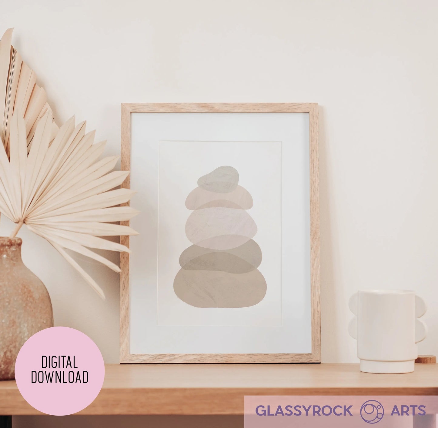 The Ombre Nude Modern Stone Shapes Digital Art printable displays minimalist abstract shapes in neutral tones. It sits elegantly on a wooden shelf with a dried palm leaf in a vase and a mug. A pink circle labeled Digital Download and the Glassyrock Arts logo are prominent.