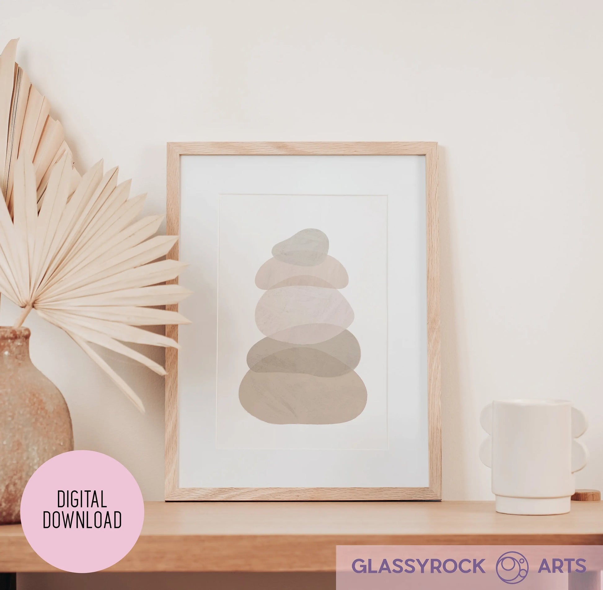 The Ombre Nude Modern Stone Shapes Digital Art printable displays minimalist abstract shapes in neutral tones. It sits elegantly on a wooden shelf with a dried palm leaf in a vase and a mug. A pink circle labeled Digital Download and the Glassyrock Arts logo are prominent.