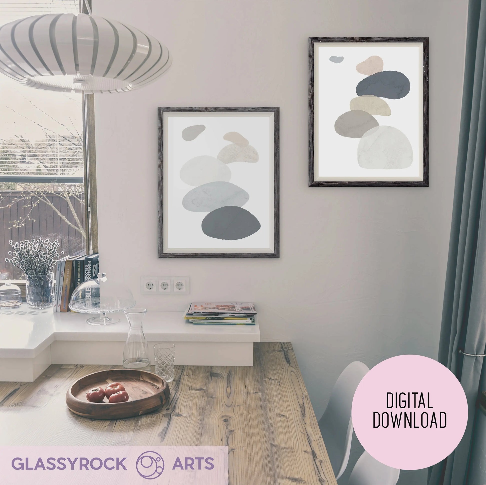 A cozy dining area includes a wooden table with a bowl of apples, and framed Abstract Watercolor Stone Shapes Digital Art. Sunlight through blinds highlights the soft-colored, overlapping shapes. A label reads Instant Digital File from Glassyrock Arts.