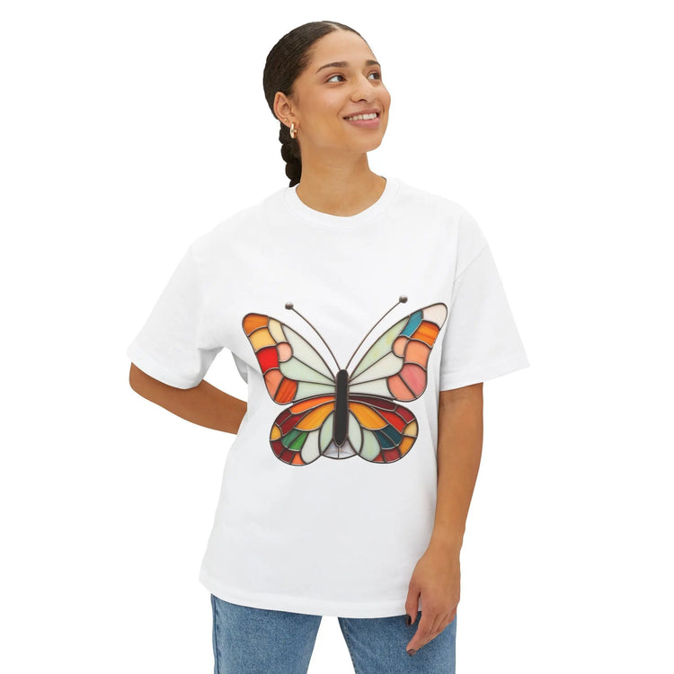 A woman wears the stained glass groovy butterfly unisex t-shirt in white, from GlassyRock Arts.