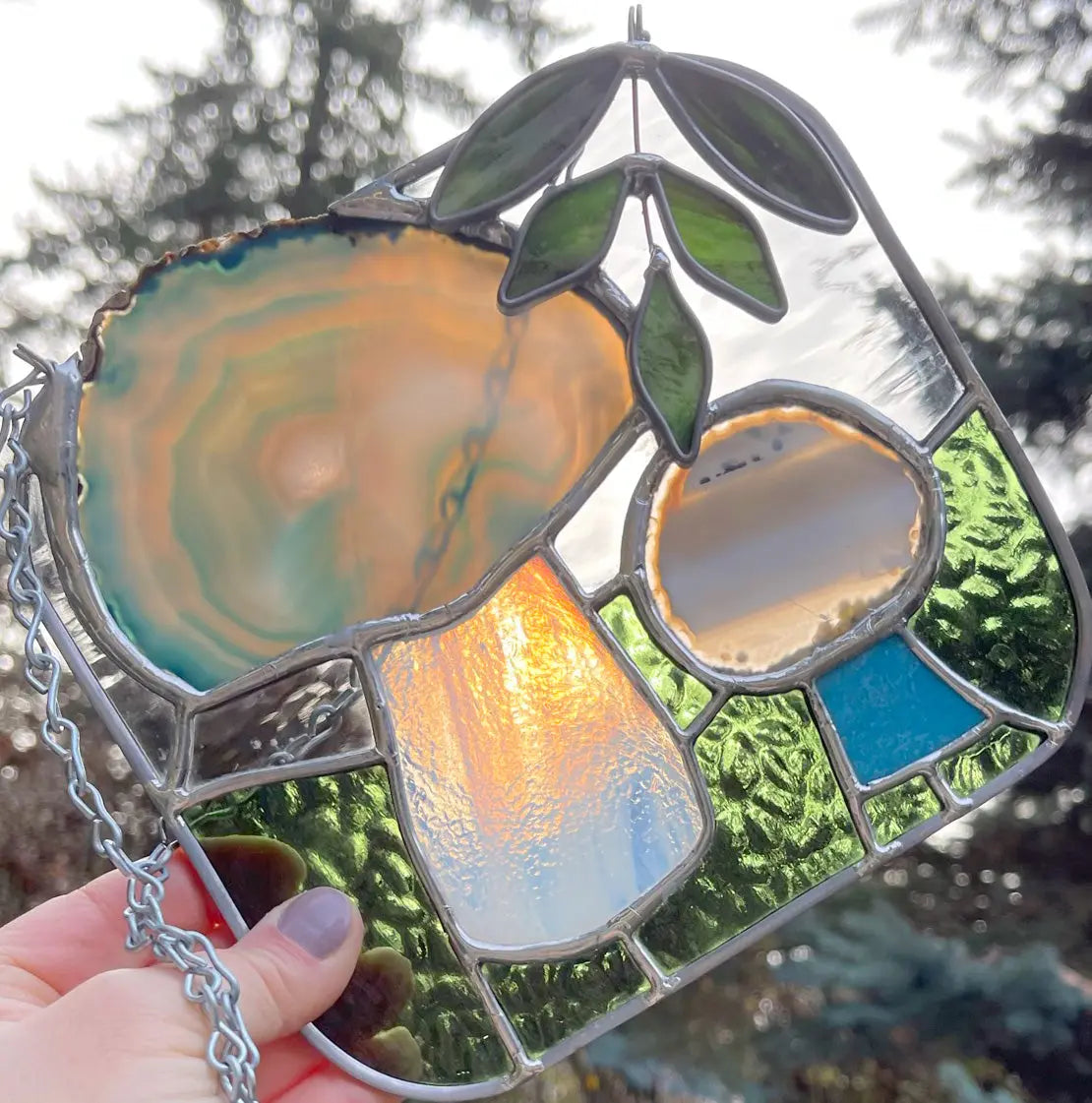 An image of the stained glass mushrooms suncatcher from GlassyRock Arts.