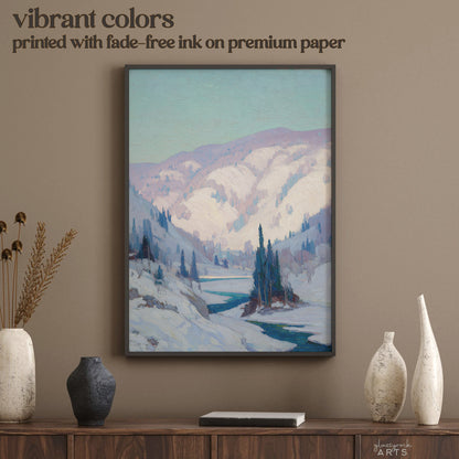 Framed mountain landscape print on a wall above a wooden console table with decorative vases.