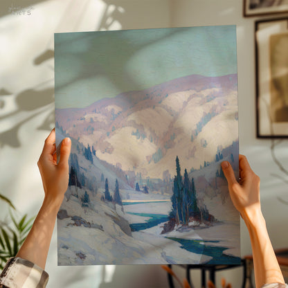 Person holding a painting of a snowy landscape with mountains and trees.
