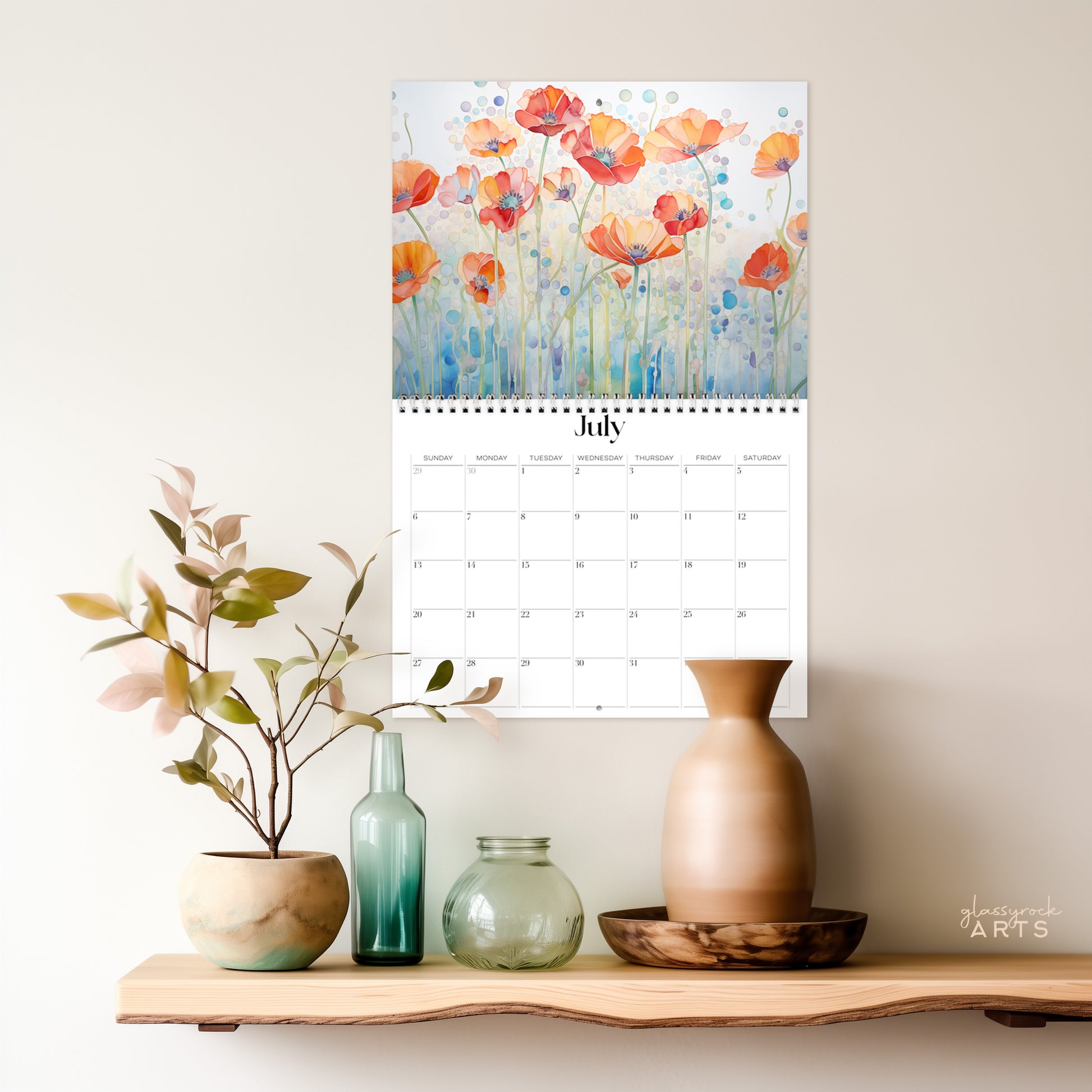 The poppies calendar hanging on a wall above a shelf.