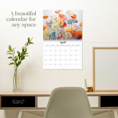 The poppies calendar hanging on a white wall over a desk. The text reads "a beautiful calendar for any space."