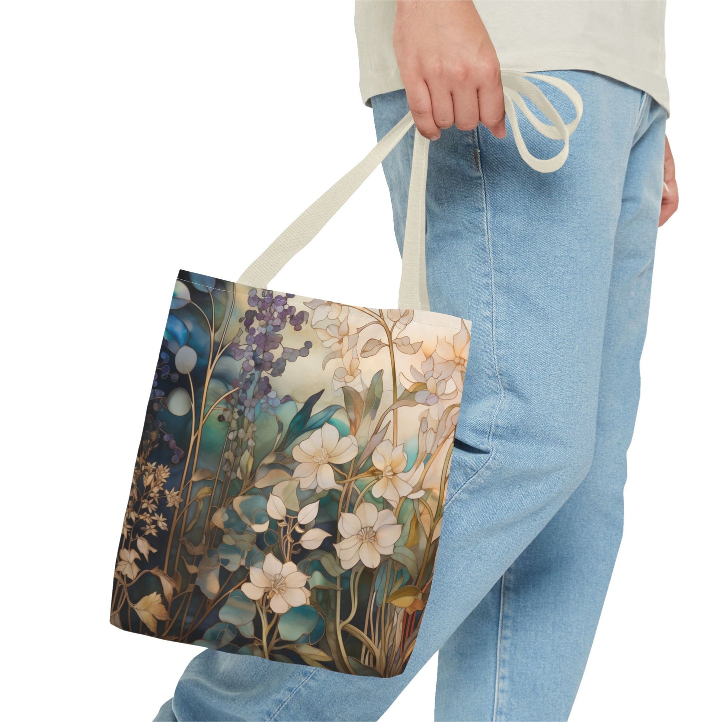 A person carrying a Stained Glass Midnight Flowers Tote Bag, which is crafted from durable polyester and adorned with a detailed floral pattern featuring white, blue, and purple flowers. The individual is wearing light blue jeans and a light-colored top.