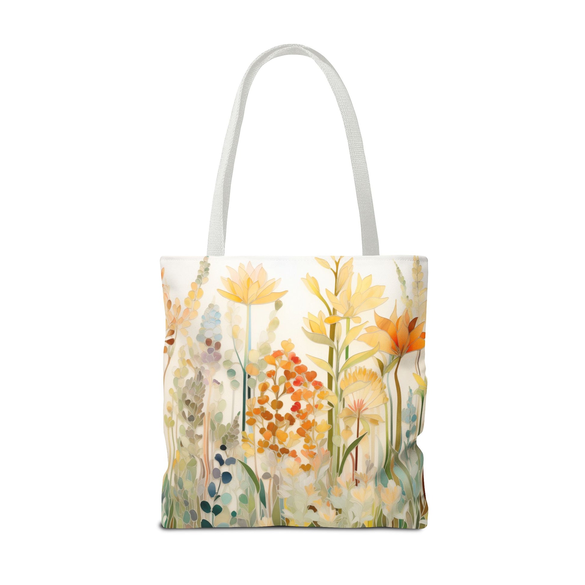 The Stained Glass Fall Flowers Tote Bag, available in three sizes, features white straps and showcases a colorful floral design in various shades of yellow, orange, and green on a white background. It is made from durable polyester materials.