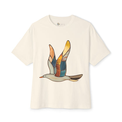 A sustainable Stained Glass Seagull Oversized Tee Shirt by Bella+Canvas, showcasing a vibrant stained-glass design of a flying bird on the front.