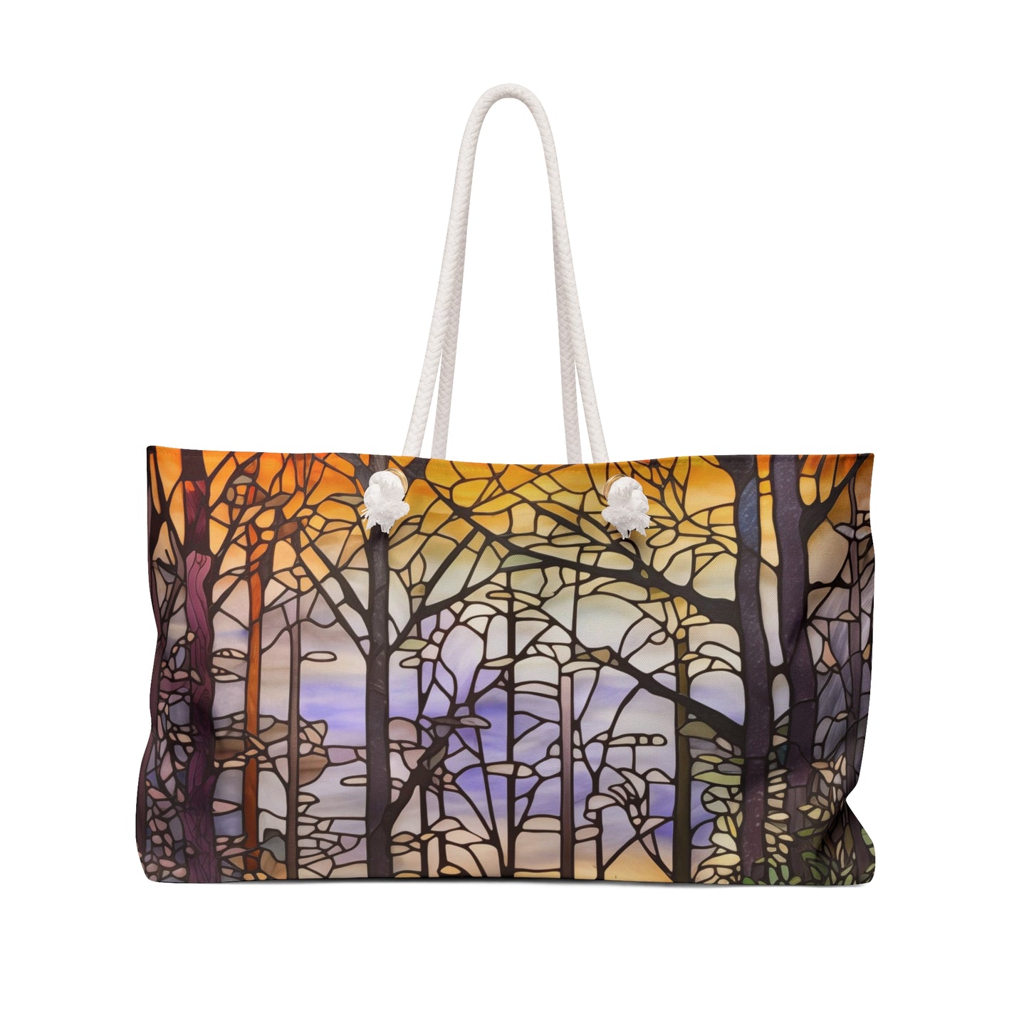 The Stained Glass Forest Oversized Tote Bag displays a vivid stained glass pattern featuring trees against an orange, yellow, purple, and blue sky. Its sturdy white rope handles make it an ideal gift for art enthusiasts.