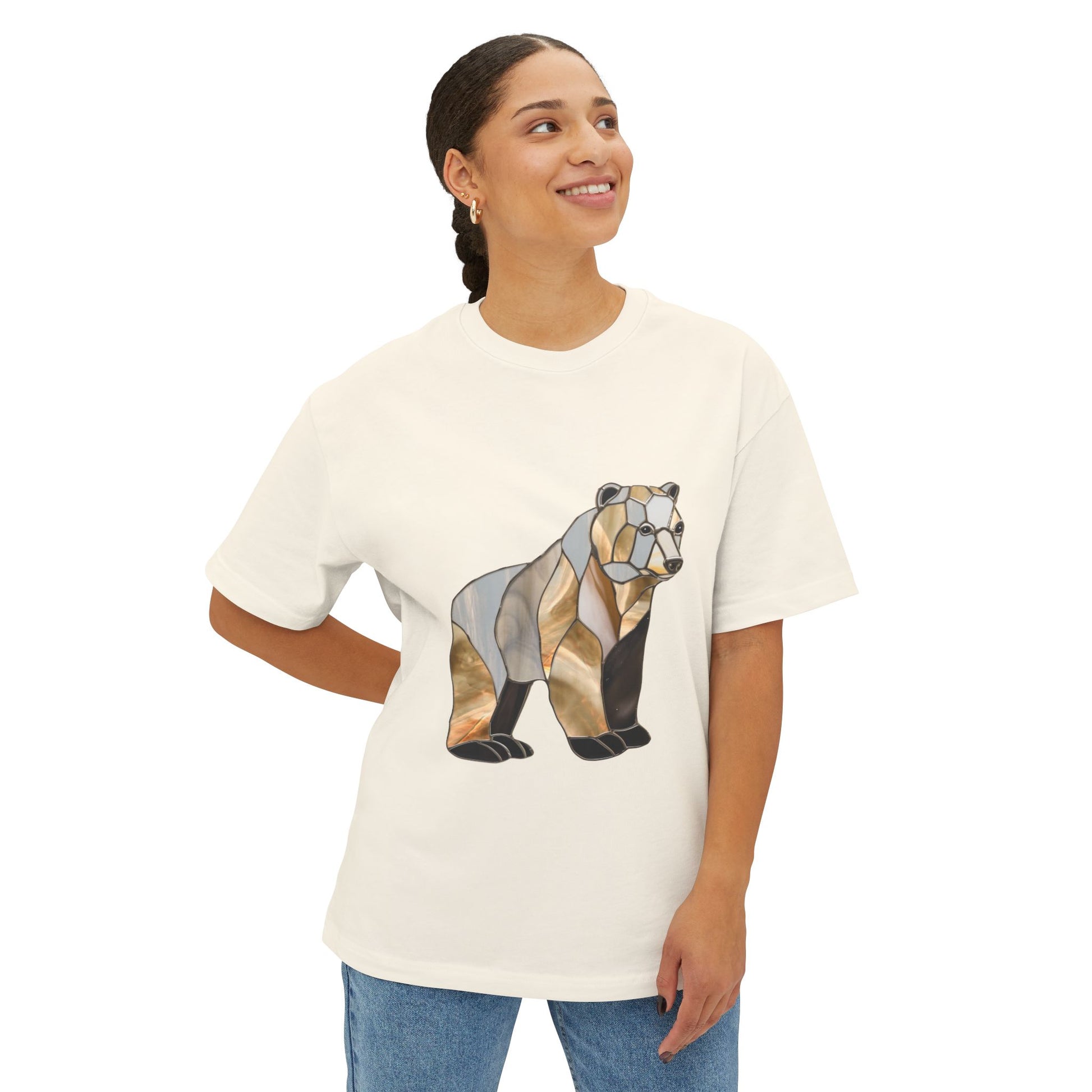 A person wearing a Stained Glass Grizzly Bear Oversized Tee Shirt, standing against a plain white background and smiling while looking to the side.