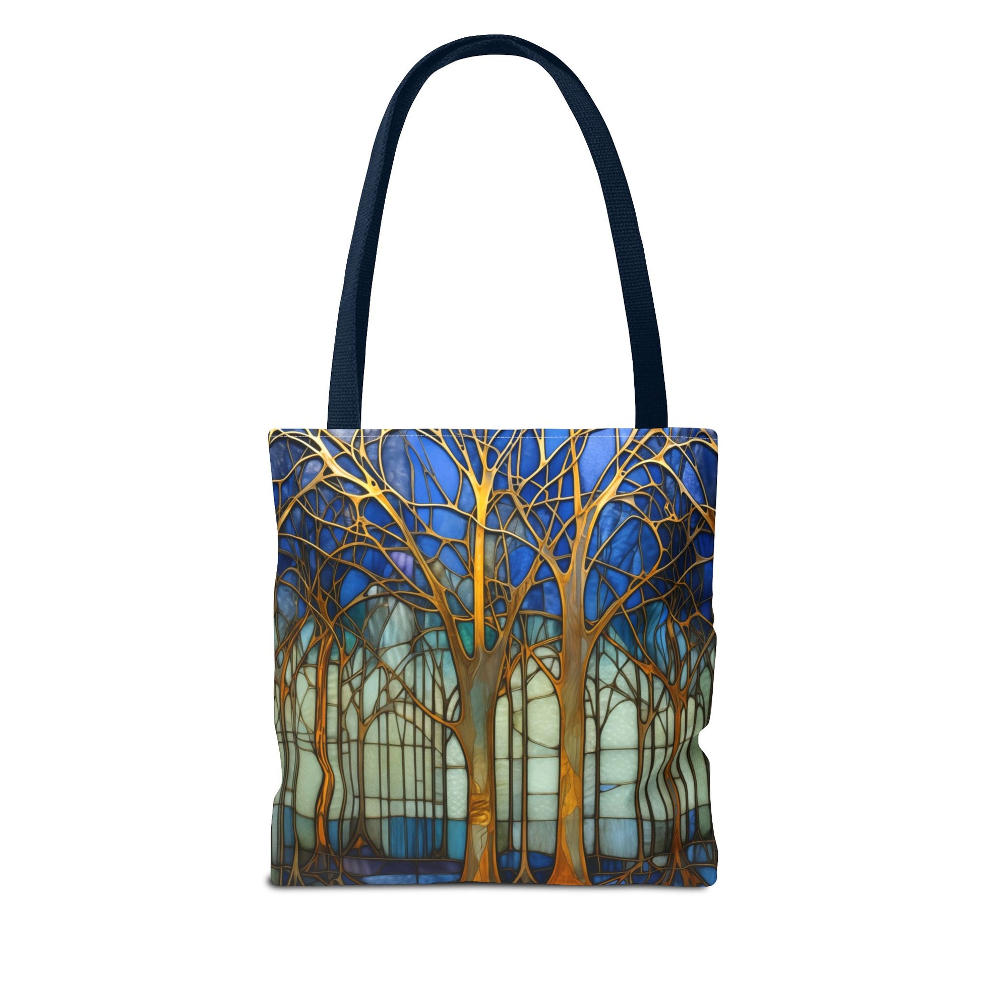 The Stained Glass Forest Tote Bag, in blue, features stylized tree branches in vibrant blues, golds, and greens on durable polyester.