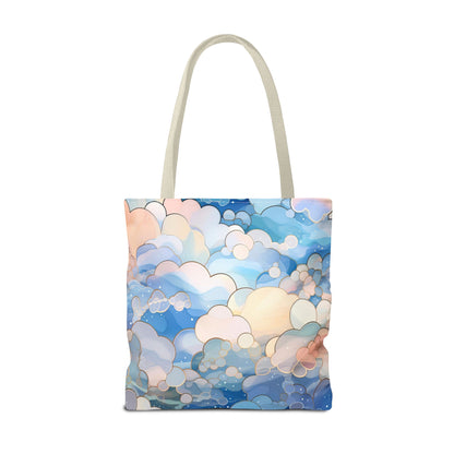 The Stained Glass Clouds Tote Bag, available in blue and three sizes, features a dreamlike abstract cloud design in shades of blue, pink, and cream with durable polyester construction and simple beige handles, ideal for everyday use.