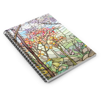 The Stained Glass Spring Forest Lined Spiral Notebook features a vibrant stained glass cover with trees and leaves in orange, pink, and green hues, perfect for journaling or as a stained glass gift.