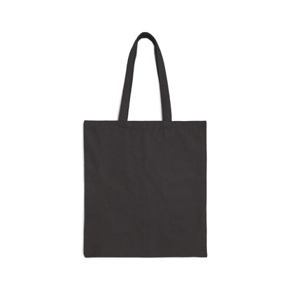 A Stained Glass Cactus Teardrop Cotton Canvas Tote Bag lies flat on a white background. Designed by Noelle Barnes, the black bag has two handles, a simple rectangular shape, and appears to be made of sturdy fabric.