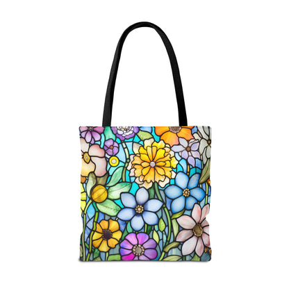 The Stained Glass Folk Art Flowers Tote Bag, available in three sizes, showcases an original design with vibrant blue, pink, yellow, and purple flowers. Featuring black handles and durable polyester construction, this bag combines artistic flair with practical use.