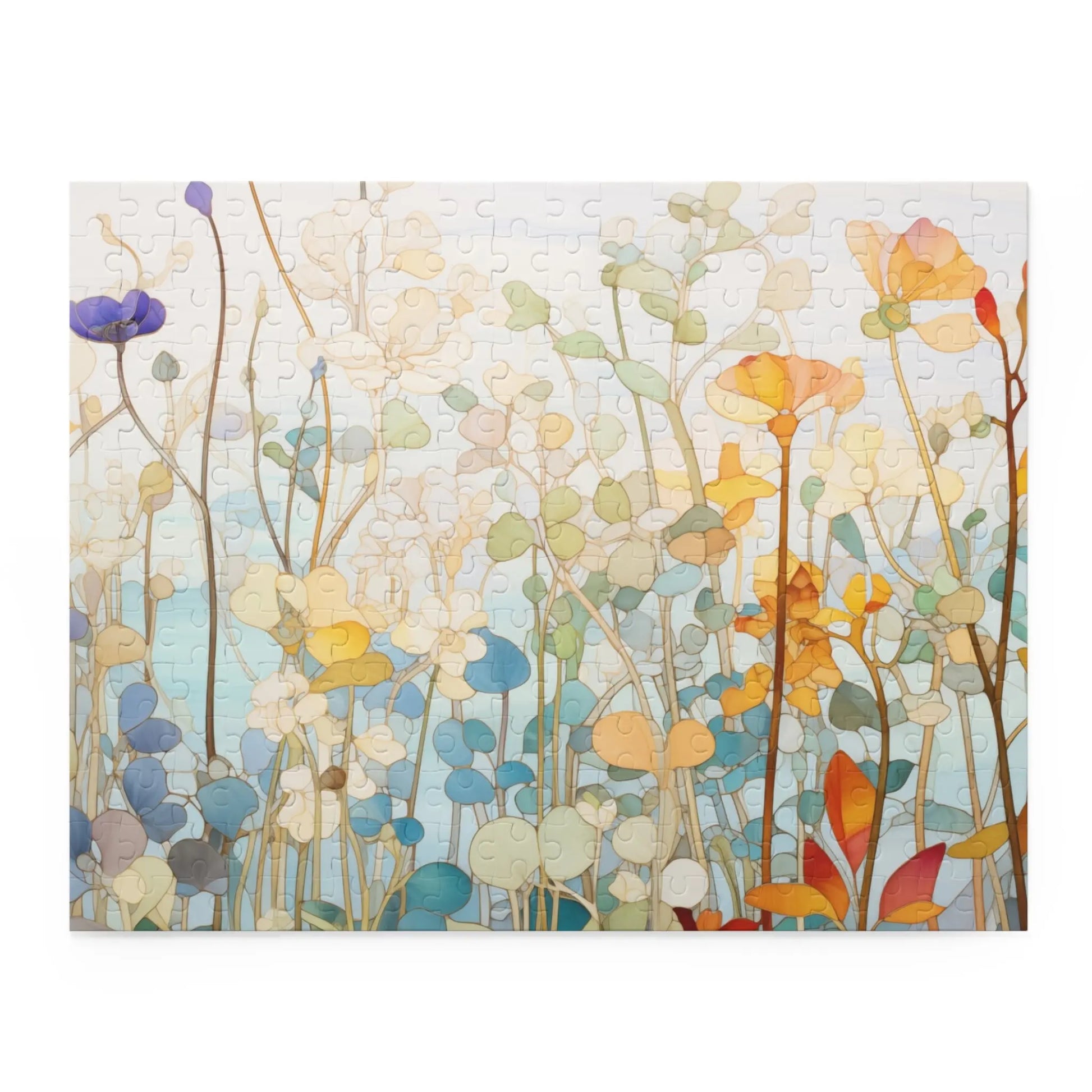 The Wildflower Botanicals Jigsaw Puzzle is a vibrant floral gift featuring artful pastel illustrations of orange, blue, yellow, and lilac flowers and stems on a light blue background.