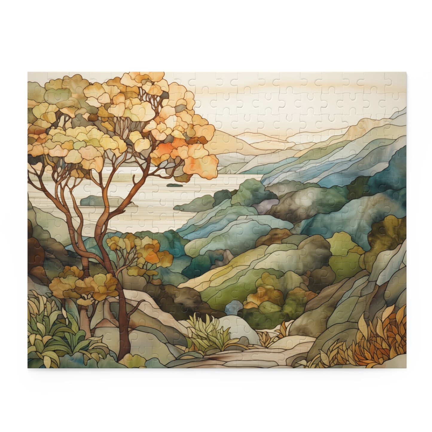 A jigsaw puzzle with a coastal scene of the Big Sur area of California, with a large tree on the left and mountains on the right and ocean in the distance. The illustration is in a stained glass style in muted colors. 