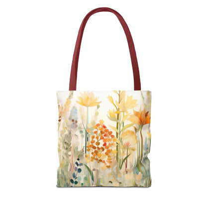 The Stained Glass Fall Flowers Tote Bag, available in 3 sizes, features an original floral design with soft yellow, orange, and green hues on a light cream background. It has a deep red strap and is crafted from durable polyester.