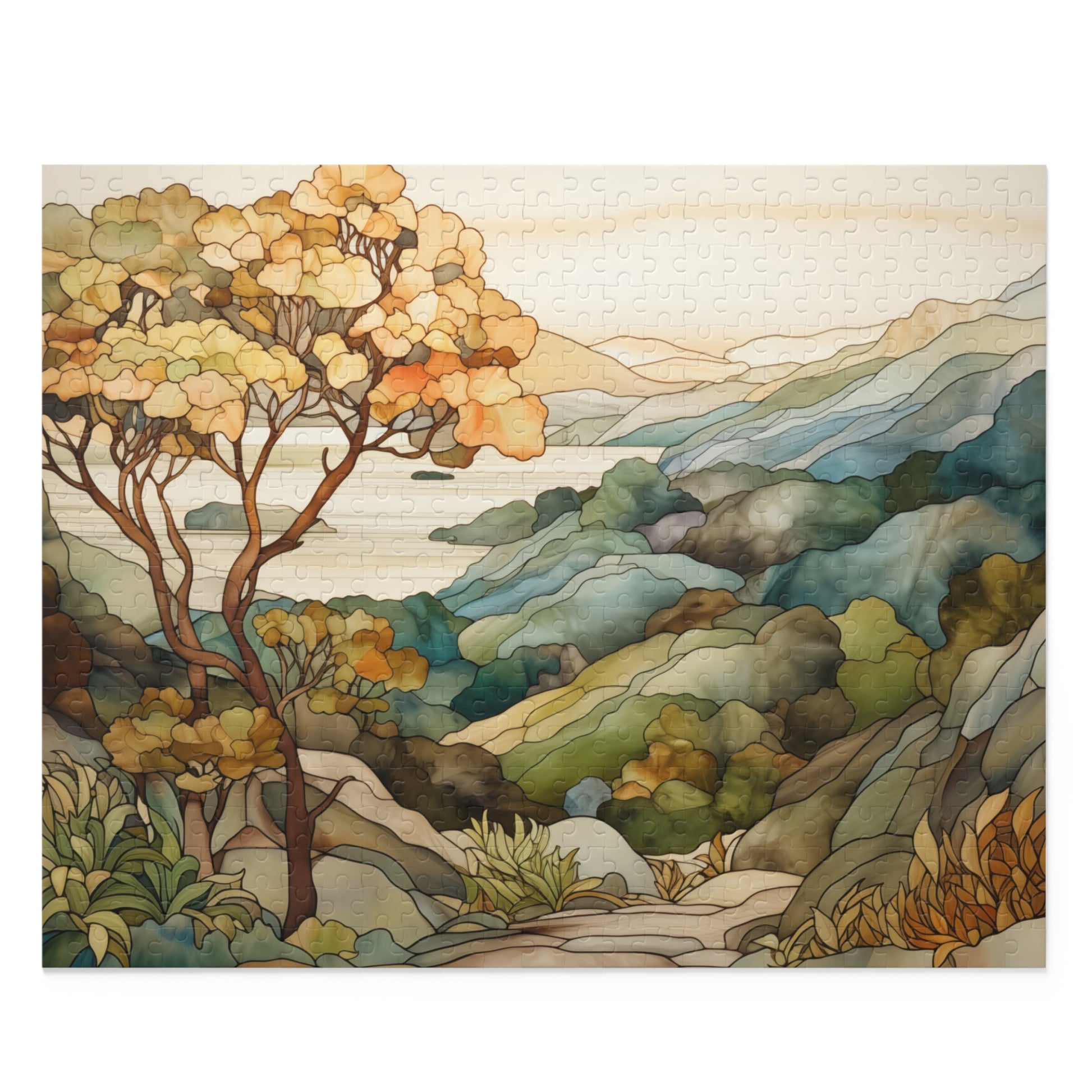 A jigsaw puzzle with a coastal scene of the Big Sur area of California, with a large tree on the left and mountains on the right and ocean in the distance. The illustration is in a stained glass style in muted colors. 