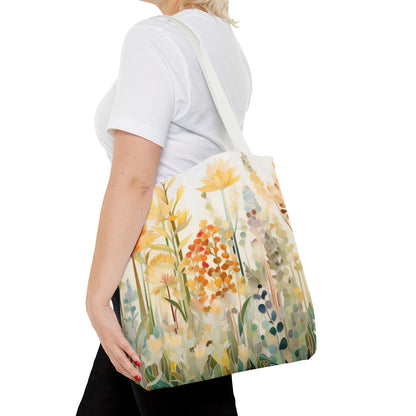 A person with blonde hair is wearing a white shirt and holding a Stained Glass Fall Flowers Tote Bag, showcasing an original artist design with a floral pattern.