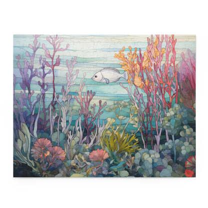 An image of a jigsaw puzzle featuring a stained glass illustration of a silver fish swimming amongst a purple, orange and pink coral reef. 